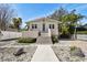 Charming home featuring neutral siding, inviting front porch, and a well-manicured lawn at 652 Ohio Pl, Sarasota, FL 34236