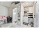 Cozy living space featuring a convenient kitchenette, bathroom, and work desk at 652 Ohio Pl, Sarasota, FL 34236