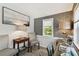 Cozy office area with neutral decor, wallpaper, and natural light from the window at 652 Ohio Pl, Sarasota, FL 34236