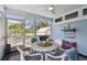 Inviting porch with stylish furnishings, ceiling fan, and scenic outdoor view at 652 Ohio Pl, Sarasota, FL 34236