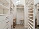 Spacious walk-in closet with custom shelving and drawers, designed for optimal organization at 652 Ohio Pl, Sarasota, FL 34236