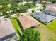 Residential home featuring lush greenery, a well-kept lawn, and a serene backyard view at 6838 44Th E Ter, Bradenton, FL 34203