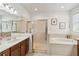 Bright bathroom features a glass-enclosed shower and a large soaking tub at 6838 44Th E Ter, Bradenton, FL 34203
