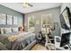 Cozy bedroom with a modern desk and exercise bike at 6838 44Th E Ter, Bradenton, FL 34203