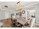 Elegant dining room with a modern chandelier, stylish furniture, and seamless access to the living room at 6838 44Th E Ter, Bradenton, FL 34203