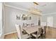 Chic dining area with contemporary light fixture, seating for six, and stylish decor for memorable gatherings at 6838 44Th E Ter, Bradenton, FL 34203