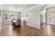 Dining area showcases hardwood floors, modern chandelier, and an adjacent entry to the front door at 6838 44Th E Ter, Bradenton, FL 34203