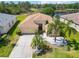 Inviting single-story home showcasing a well-manicured lawn, palm trees, and an attached garage at 6838 44Th E Ter, Bradenton, FL 34203