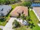 Aerial view of a lovely one-story home with a well-maintained lawn and palm tree landscaping at 6838 44Th E Ter, Bradenton, FL 34203