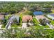 A lovely residence features a well-manicured lawn, swaying palm trees, and a wide driveway at 6838 44Th E Ter, Bradenton, FL 34203