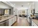Open floor plan showcasing kitchen with bar seating and living area with lots of natural light at 6838 44Th E Ter, Bradenton, FL 34203