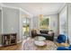 Bright living space featuring hardwood floors, chandelier, and a large sliding glass door that leads to the backyard at 6838 44Th E Ter, Bradenton, FL 34203