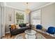 Inviting living room features hardwood floors, chandelier, lots of natural light, and comfortable seating area at 6838 44Th E Ter, Bradenton, FL 34203