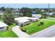 Aerial shot of a well-maintained home featuring lush greenery, and a long driveway at 7114 11Th W Ave, Bradenton, FL 34209