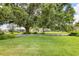 Scenic community green with lush landscaping and beautiful shade trees at 7114 11Th W Ave, Bradenton, FL 34209
