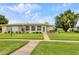 Charming home with a well-manicured lawn and inviting front entrance at 7114 11Th W Ave, Bradenton, FL 34209
