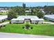Beautifully landscaped home boasts a well-manicured lawn and charming curb appeal in a serene neighborhood at 7114 11Th W Ave, Bradenton, FL 34209