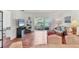 Living room with view of the sun room featuring tile floors and neutral colored walls at 7114 11Th W Ave, Bradenton, FL 34209
