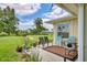 Relaxing patio with chairs and a view of the lush green lawn at 7114 11Th W Ave, Bradenton, FL 34209
