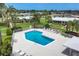 Community pool with ample seating and well-maintained surroundings at 7114 11Th W Ave, Bradenton, FL 34209