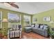 Bright sun room features a seating area, tile floors, and lots of natural light at 7114 11Th W Ave, Bradenton, FL 34209