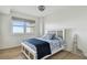 Cozy bedroom with a queen bed and a view of the ocean from the window at 750 N Tamiami Trl # 1203, Sarasota, FL 34236
