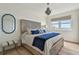 Bedroom with custom bed frame, light wood floors, neutral walls and plenty of natural light at 750 N Tamiami Trl # 1203, Sarasota, FL 34236