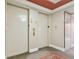Hallway featuring access to resident elevators at 750 N Tamiami Trl # 1203, Sarasota, FL 34236