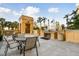 Outdoor grill area with seating, ideal for entertaining guests in a resort-style setting at 750 N Tamiami Trl # 1203, Sarasota, FL 34236