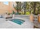 Inviting hot tub area surrounded by manicured landscaping, perfect for relaxation at 750 N Tamiami Trl # 1203, Sarasota, FL 34236