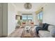 Cozy living room with water views, stylish furnishings, and plenty of natural light at 750 N Tamiami Trl # 1203, Sarasota, FL 34236
