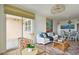 Inviting living room with access to balcony, scenic water views, and an adjacent dining area at 750 N Tamiami Trl # 1203, Sarasota, FL 34236