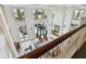 Bright lobby featuring soaring ceilings, large windows, elegant furnishings, and a staircase with wood railings at 750 N Tamiami Trl # 1203, Sarasota, FL 34236