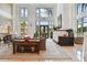 Bright lobby featuring soaring ceilings, large windows, elegant furnishings, and neutral paint at 750 N Tamiami Trl # 1203, Sarasota, FL 34236