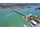 Beautiful aerial view of a bridge over turquoise water with boat traffic and waterfront properties at 763 Siesta Dr, Sarasota, FL 34242