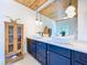 Stylish bathroom with dual vessel sinks, wood accents, and modern fixtures at 763 Siesta Dr, Sarasota, FL 34242