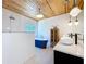 Bathroom with a soaking tub, glass shower, and modern vanity lighting at 763 Siesta Dr, Sarasota, FL 34242