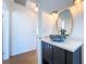 The bathroom vanity includes a unique sink bowl and a classic mirror at 763 Siesta Dr, Sarasota, FL 34242