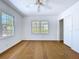 This bedroom features wood floors, neutral walls, and natural light at 763 Siesta Dr, Sarasota, FL 34242