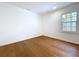 This bright bedroom is a blank canvas featuring wood floors and natural light at 763 Siesta Dr, Sarasota, FL 34242