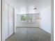 Bright bedroom with shiplap walls and ceiling, closet with louvered doors, and 2 windows at 763 Siesta Dr, Sarasota, FL 34242