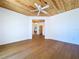 Hardwood floors and wood paneled ceilings are featured in this bedroom at 763 Siesta Dr, Sarasota, FL 34242