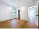 The bedroom offers wood floors and a neutral color palette, perfect for a tranquil retreat at 763 Siesta Dr, Sarasota, FL 34242