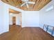 Bright bedroom featuring wood ceiling, hardwood floors, and an adjacent closet at 763 Siesta Dr, Sarasota, FL 34242