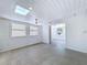Bonus room featuring shiplap walls, recessed lighting, a skylight, and views to next room at 763 Siesta Dr, Sarasota, FL 34242
