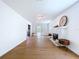 Bright living room boasts wood floors, fireplace and leads to the sun room with French doors at 763 Siesta Dr, Sarasota, FL 34242