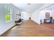 Bright living room showcasing hardwood floors and a classic brick fireplace at 763 Siesta Dr, Sarasota, FL 34242