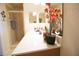 Bright bathroom featuring a spacious vanity with sleek countertops and a glass-enclosed shower stall at 7803 Grand Estuary Trl # 205, Bradenton, FL 34212