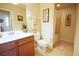 The bathroom has a white toilet and a shower with a bathtub at 7803 Grand Estuary Trl # 205, Bradenton, FL 34212