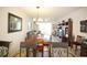 Open concept floor plan with dining room, living room, and access to the balcony at 7803 Grand Estuary Trl # 205, Bradenton, FL 34212
